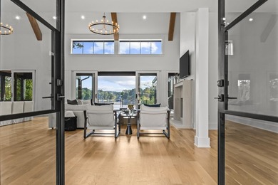 MODERN CALIFORNIA-INSPIRED LAKEFRONT RETREAT WITH POOL | Built on Harbor Club Golf and Country Club in Georgia - for sale on GolfHomes.com, golf home, golf lot