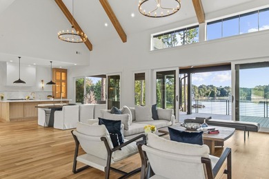 MODERN CALIFORNIA-INSPIRED LAKEFRONT RETREAT WITH POOL | Built on Harbor Club Golf and Country Club in Georgia - for sale on GolfHomes.com, golf home, golf lot