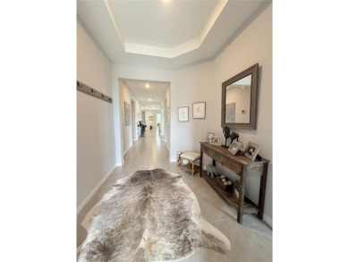 Experience luxury, flexibility, and privacy in this stunning and on Trilogy at Ocala Preserve in Florida - for sale on GolfHomes.com, golf home, golf lot