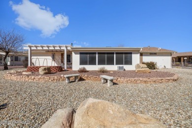 Designed for both comfort and style, this home is truly a gem on Quail Wood Greens Golf Course in Arizona - for sale on GolfHomes.com, golf home, golf lot