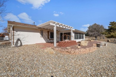 Designed for both comfort and style, this home is truly a gem on Quail Wood Greens Golf Course in Arizona - for sale on GolfHomes.com, golf home, golf lot