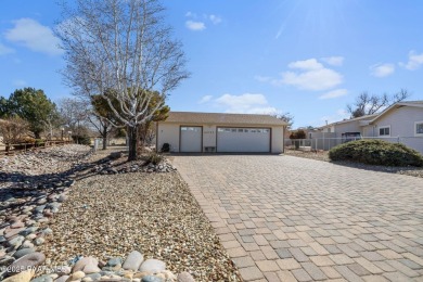 Designed for both comfort and style, this home is truly a gem on Quail Wood Greens Golf Course in Arizona - for sale on GolfHomes.com, golf home, golf lot