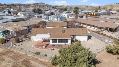 Designed for both comfort and style, this home is truly a gem on Quail Wood Greens Golf Course in Arizona - for sale on GolfHomes.com, golf home, golf lot