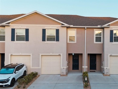 Welcome to this nearly brand-new waterfront townhouse located in on Ridgewood Lakes Golf and Country Club in Florida - for sale on GolfHomes.com, golf home, golf lot