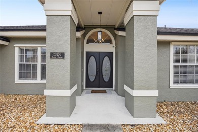 Welcome to your beautifully updated pool and hot tub home in the on Wedgefield Golf Club in Florida - for sale on GolfHomes.com, golf home, golf lot