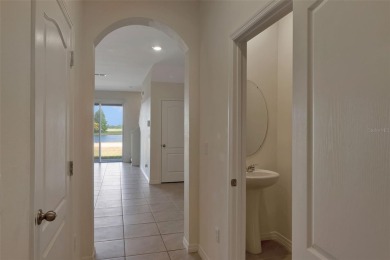 Welcome to this nearly brand-new waterfront townhouse located in on Ridgewood Lakes Golf and Country Club in Florida - for sale on GolfHomes.com, golf home, golf lot