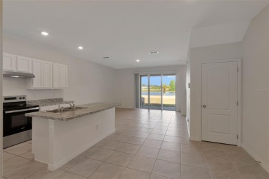 Welcome to this nearly brand-new waterfront townhouse located in on Ridgewood Lakes Golf and Country Club in Florida - for sale on GolfHomes.com, golf home, golf lot