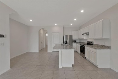 Welcome to this nearly brand-new waterfront townhouse located in on Ridgewood Lakes Golf and Country Club in Florida - for sale on GolfHomes.com, golf home, golf lot
