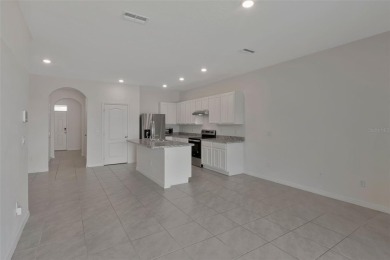 Welcome to this nearly brand-new waterfront townhouse located in on Ridgewood Lakes Golf and Country Club in Florida - for sale on GolfHomes.com, golf home, golf lot