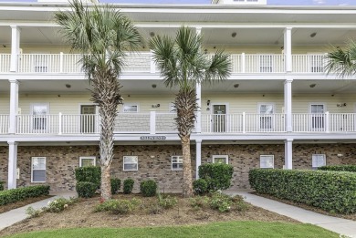 This charming 2-bedroom, 2-bathroom second-floor end unit is on Barefoot Resort and Golf Club  in South Carolina - for sale on GolfHomes.com, golf home, golf lot