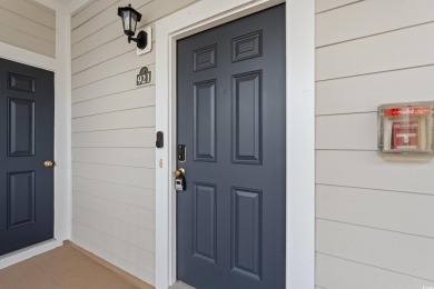 This charming 2-bedroom, 2-bathroom second-floor end unit is on Barefoot Resort and Golf Club  in South Carolina - for sale on GolfHomes.com, golf home, golf lot