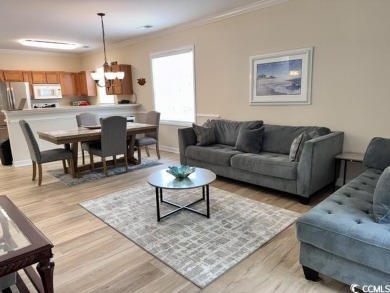 This charming 2-bedroom, 2-bathroom second-floor end unit is on Barefoot Resort and Golf Club  in South Carolina - for sale on GolfHomes.com, golf home, golf lot