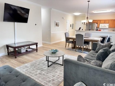 This charming 2-bedroom, 2-bathroom second-floor end unit is on Barefoot Resort and Golf Club  in South Carolina - for sale on GolfHomes.com, golf home, golf lot
