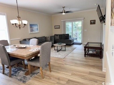 This charming 2-bedroom, 2-bathroom second-floor end unit is on Barefoot Resort and Golf Club  in South Carolina - for sale on GolfHomes.com, golf home, golf lot