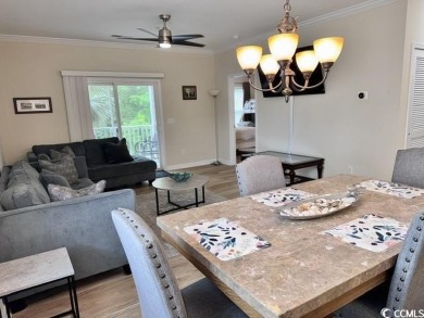 This charming 2-bedroom, 2-bathroom second-floor end unit is on Barefoot Resort and Golf Club  in South Carolina - for sale on GolfHomes.com, golf home, golf lot