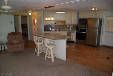 Light, airy, and inviting, this beautifully updated home is on Six Lakes Country Club in Florida - for sale on GolfHomes.com, golf home, golf lot