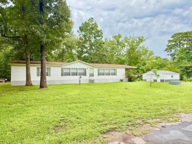 This spacious 4-bedroom, 2.5-bath home sits on a large corner on Pendleton Harbor in Texas - for sale on GolfHomes.com, golf home, golf lot