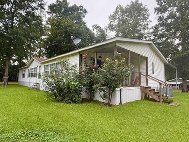 This spacious 4-bedroom, 2.5-bath home sits on a large corner on Pendleton Harbor in Texas - for sale on GolfHomes.com, golf home, golf lot