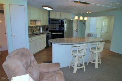 Light, airy, and inviting, this beautifully updated home is on Six Lakes Country Club in Florida - for sale on GolfHomes.com, golf home, golf lot