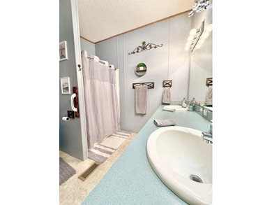 This spacious 4-bedroom, 2.5-bath home sits on a large corner on Pendleton Harbor in Texas - for sale on GolfHomes.com, golf home, golf lot