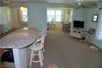 Light, airy, and inviting, this beautifully updated home is on Six Lakes Country Club in Florida - for sale on GolfHomes.com, golf home, golf lot