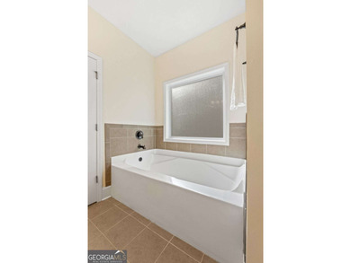 PRICED BELOW APPRAISAL with exceptional seller incentives! This on Canongate At Heron Bay in Georgia - for sale on GolfHomes.com, golf home, golf lot