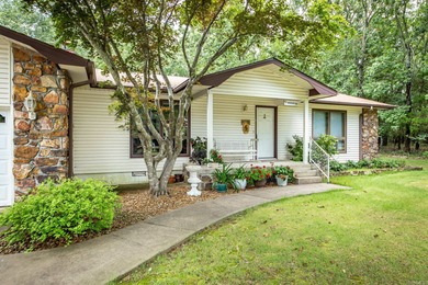 Welcome to your dream home nestled on a quiet, tree-lined on Indian Hills Country Club in Arkansas - for sale on GolfHomes.com, golf home, golf lot