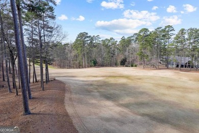 Situated along the highly sought-after Richland golf course at on Reynolds Lake Oconee - The Oconee in Georgia - for sale on GolfHomes.com, golf home, golf lot