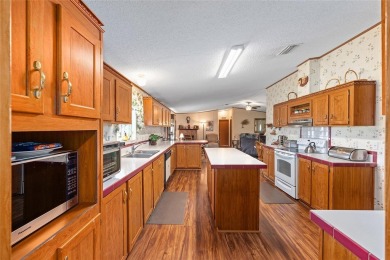 Welcome to this spacious 3-bedroom, 2-bathroom golf-course view on The Links of Spruce Creek in Florida - for sale on GolfHomes.com, golf home, golf lot