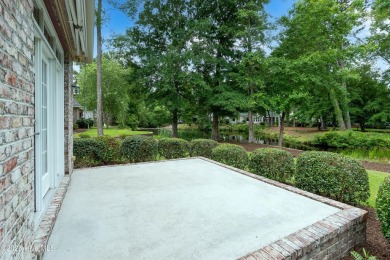 Nestled in a quiet cul-de-sac and backed by a serene pond shaded on Members Club At St. James Plantation in North Carolina - for sale on GolfHomes.com, golf home, golf lot
