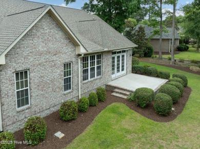Nestled in a quiet cul-de-sac and backed by a serene pond shaded on Members Club At St. James Plantation in North Carolina - for sale on GolfHomes.com, golf home, golf lot