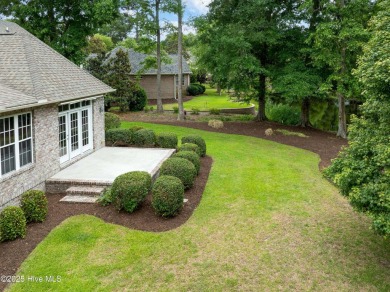 Nestled in a quiet cul-de-sac and backed by a serene pond shaded on Members Club At St. James Plantation in North Carolina - for sale on GolfHomes.com, golf home, golf lot