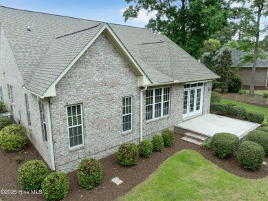 Nestled in a quiet cul-de-sac and backed by a serene pond shaded on Members Club At St. James Plantation in North Carolina - for sale on GolfHomes.com, golf home, golf lot