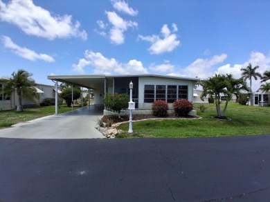 This lovely 1982 mobile home comes unfurnished and is poised and on Royal Wood Golf and Country Club in Florida - for sale on GolfHomes.com, golf home, golf lot