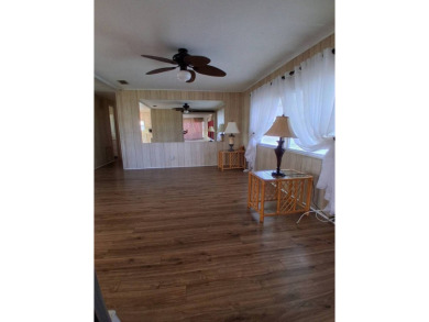 This lovely 1982 mobile home comes unfurnished and is poised and on Royal Wood Golf and Country Club in Florida - for sale on GolfHomes.com, golf home, golf lot