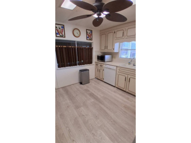 This lovely 1982 mobile home comes unfurnished and is poised and on Royal Wood Golf and Country Club in Florida - for sale on GolfHomes.com, golf home, golf lot