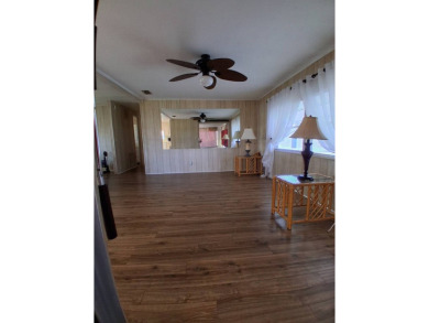 This lovely 1982 mobile home comes unfurnished and is poised and on Royal Wood Golf and Country Club in Florida - for sale on GolfHomes.com, golf home, golf lot