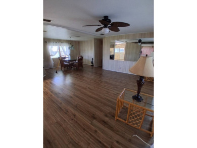 This lovely 1982 mobile home comes unfurnished and is poised and on Royal Wood Golf and Country Club in Florida - for sale on GolfHomes.com, golf home, golf lot