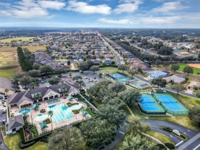 This home is a lovely Saint Augustine model with a few custom on Summerglen Country Club in Florida - for sale on GolfHomes.com, golf home, golf lot