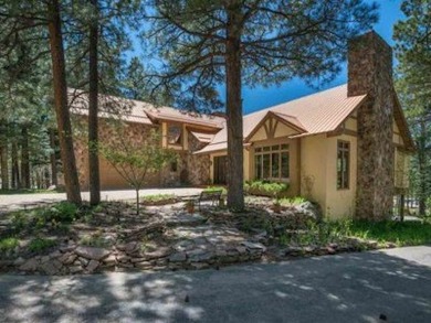Surrounded by ponderosa pine and opening on to the ninth green on Pendaries Village Community Assoc. in New Mexico - for sale on GolfHomes.com, golf home, golf lot