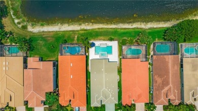 Discover the splendor of this exquisite lakeside residence on Arrowhead Golf Club At Heritage Greens in Florida - for sale on GolfHomes.com, golf home, golf lot