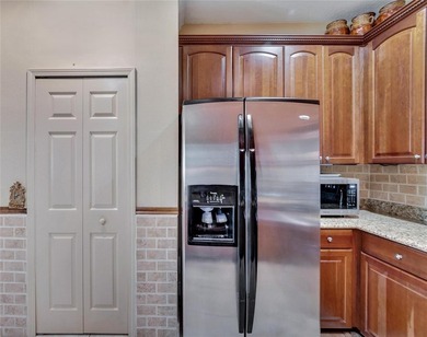 Welcome to this beautifully maintained Beachcomber model villa on Apollo Beach Golf and Sea Club in Florida - for sale on GolfHomes.com, golf home, golf lot