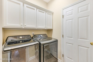 Discover relaxed coastal living in this charming 3-bedroom on Carolina National Golf Club in North Carolina - for sale on GolfHomes.com, golf home, golf lot