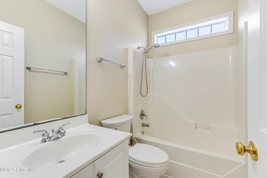 Discover relaxed coastal living in this charming 3-bedroom on Carolina National Golf Club in North Carolina - for sale on GolfHomes.com, golf home, golf lot