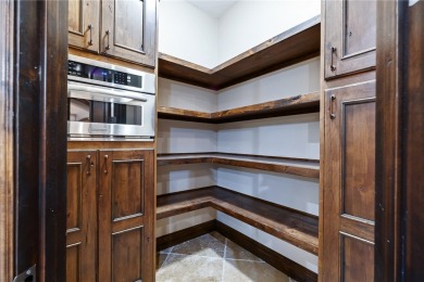 Nearly 6,000 Sq Ft of Purposeful Luxury with Dual Primary Suites on Laughlin Ranch Golf Club in Arizona - for sale on GolfHomes.com, golf home, golf lot