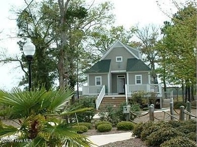 Discover relaxed coastal living in this charming 3-bedroom on Carolina National Golf Club in North Carolina - for sale on GolfHomes.com, golf home, golf lot