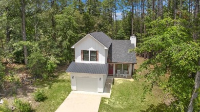 Modern Elegance meets Tranquil Luxury in this 2023-built on Rayburn Country Club in Texas - for sale on GolfHomes.com, golf home, golf lot