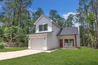 Modern Elegance meets Tranquil Luxury in this 2023-built on Rayburn Country Club in Texas - for sale on GolfHomes.com, golf home, golf lot