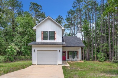 Modern Elegance meets Tranquil Luxury in this 2023-built on Rayburn Country Club in Texas - for sale on GolfHomes.com, golf home, golf lot