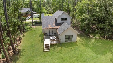 Modern Elegance meets Tranquil Luxury in this 2023-built on Rayburn Country Club in Texas - for sale on GolfHomes.com, golf home, golf lot